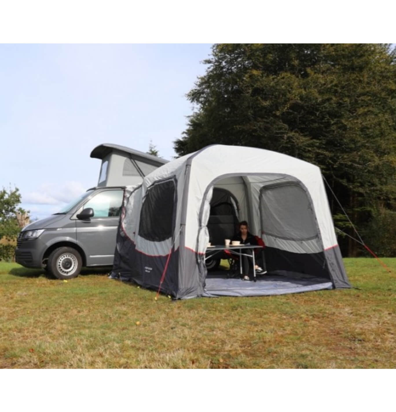 Vango Agora pitched to a VW and seated  with camping furniture