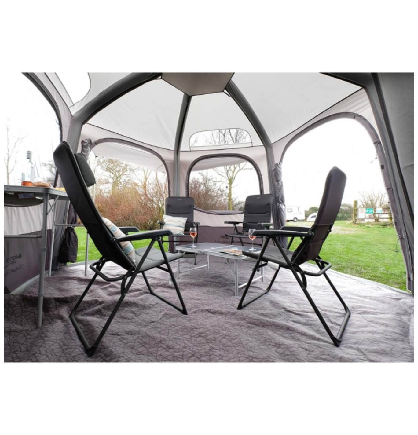 the vango hexway low set up with tables and chairs